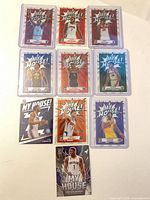 Group shot of 11 Donruss Optic My House cards in toploaders