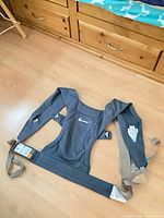 Front view of Ergobaby carrier with straps and waistband spread out