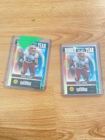 Two Chase Young Contenders Rookie of the Year cards in top-loaders