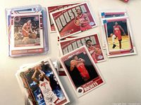 Stack of sleeved and toploaded Rockets cards plus unsleeved pile and several laid out showing designs and parallels