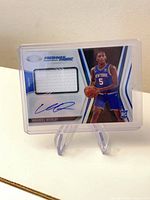 Front of Immanuel Quickley Freshman Fabric rookie patch autograph card in protective case