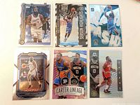 Six cards laid out including Prizm, Season Highlights, Splash, Monopoly, Career Lineage, Illusions