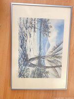 Full view of framed print showing artwork, mat, and silver frame