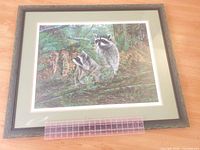 Full view of framed print with ruler for scale