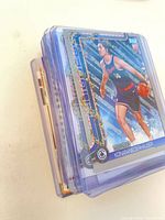 Stack of sleeved Clippers cards showing Topps parallel on top