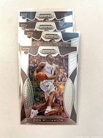 Four identical Panini Prizm Draft Picks Zion Williamson rookie cards in sleeves