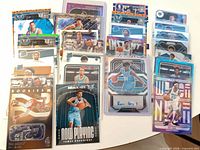 Spread of 50 basketball cards showing various Hornets, Nets and Hawks cards with rookies, parallels and inserts