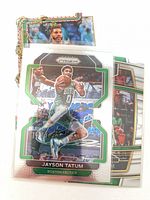 Stack of sleeved cards, top card Jayson Tatum Panini Prizm, additional cards visible beneath
