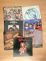Front covers of all seven LP records