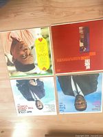 Front covers of four Nat King Cole LPs