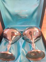 Two silver-plated goblets in blue satin presentation box