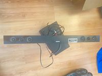 Front view of Samsung soundbar, subwoofer and cables