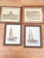 All four framed prints laid out: two architectural scenes top, two sailboats bottom