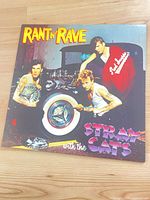 Front album jacket featuring title and band photo