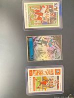 Fronts of the three sleeved rookie cards