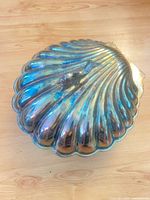 Top view of silver-plated clamshell bun warmer showing overall form and patina