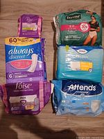 All six packages – pads, underwear and liners