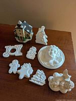 Group shot showing all twelve plaster and bisque items