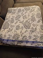 Folded quilt on sofa showing overall pattern