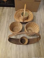 All five baskets grouped, showing relative sizes and handles