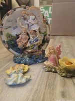 Overview of all three figurines on floor