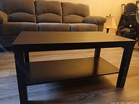 Angled front view showing entire coffee table and shelf