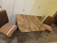 Table with two chairs showing overall set