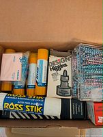 box view with Ross Stik glue, UHU glue sticks, sticky notes, Design Higgins ink, paper clips
