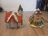 front view of both miniature ceramic houses