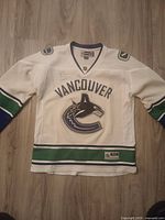 Front view of signed Reebok Vancouver Canucks women’s jersey