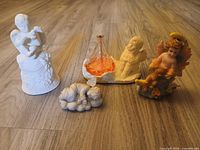 Group view of all five figurines on floor
