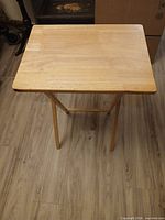 Tray table standing upright to show overall form and finish