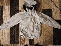 Front view of Sportek light gray hooded jacket