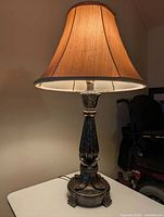 Full view of lamp with shade illuminated