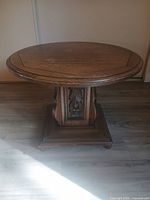 Full view of round accent table showing top surface and overall form