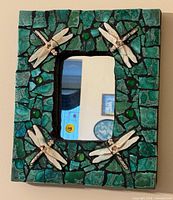 Front view showing complete mirror, mosaic frame, and ceramic dragonflies
