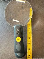 Full view of magnifier with tape measure showing 5-inch lens
