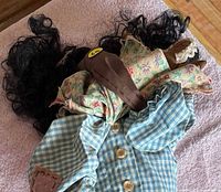 Full view of rag doll showing outfit, hair, shoes