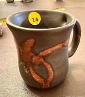 Front view showing glaze colors and handle