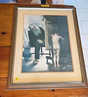 Full view of framed print on wooden surface