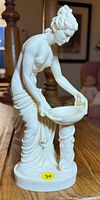 Front view of figurine showing overall form and basin