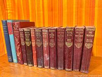 Full lineup of 14 books showing bindings and relative sizes