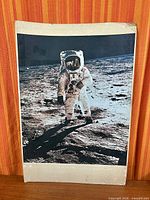 Full view of unframed Buzz Aldrin lunar poster, showing overall image and bottom margin wear