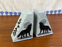 Front view showing both soapstone bookends with wolf and moon motif