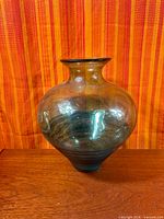 Full view of large hand-blown glass vase showing shape and color