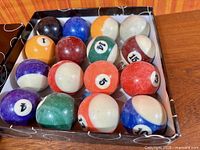 Open box showing full set of billiard balls