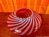 Top view showing circular opening and spiral pattern