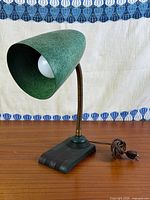 Full lamp profile showing shade, gooseneck, base and cord
