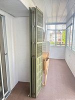 Room divider folded, side profile showing four panels connected by hinges