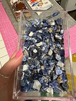 top view of box filled with blue sodalite pieces